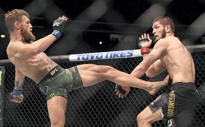 Las Vegas , United States - 6 October 2018; Conor McGregor, left, in action against Khabib Nurmagomedov in their UFC lightweight championship fight during UFC 229 at T-Mobile Arena in Las Vegas, Nevada, USA. (Photo By Stephen McCarthy/Sportsfile via Getty Images)