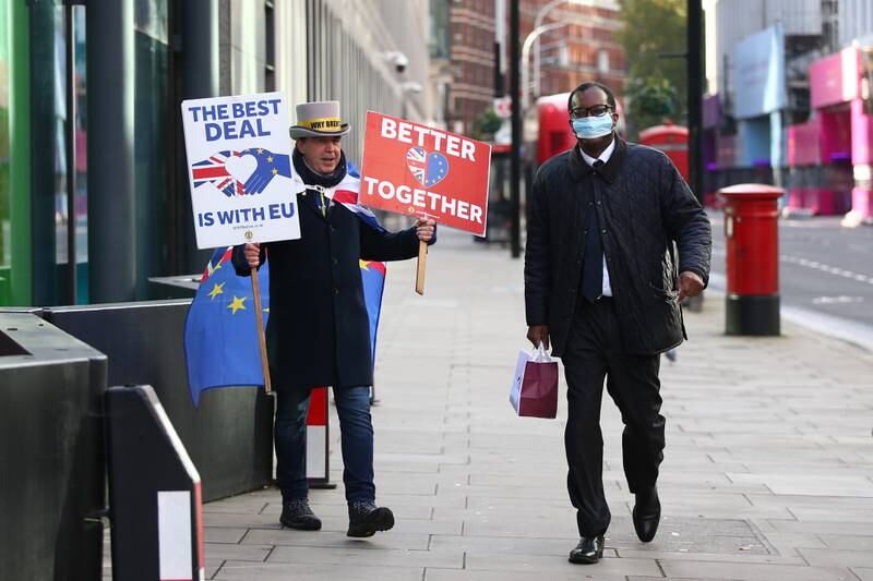 Anti-Brexit protester Steve Bray demonstrates as Kwasi Kwarteng walks past him in London in November 2020. Getty Images