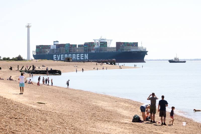 The 'Ever Given' passes beachgoers as it arrives at the Port of Felixstowe.