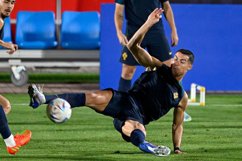 Cristiano Ronaldo attempts to block the ball during a training session. AFP