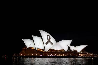 The sails of the Sydney Opera House lit with a black ribbon in remembrance and mourning of the earthquake victims. Getty