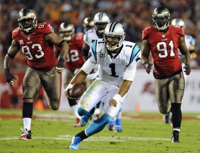 Cam Newton threw for 221 yards and registered a 111.6 passer rating on Thursday night. Brian Blanco / AP