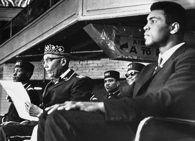 Ali with Nation of Islam leader Elijah Muhammad at a convention in Chicago in 1966. Getty