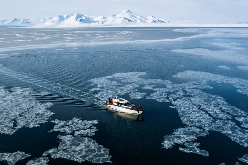 The Kvitbjorn, which means Polar Bear in Norwegian, a hybrid touristic boat, combining a diesel engine and electric batteries, makes its way in the sea ice in the Borebukta Bay, in northern Norway. Home to polar bears, the midnight sun and the northern lights, Norway's Svalbard Archipelago, perched high in the Arctic, is trying to find a way to profit from its pristine wilderness without ruining it. AFP