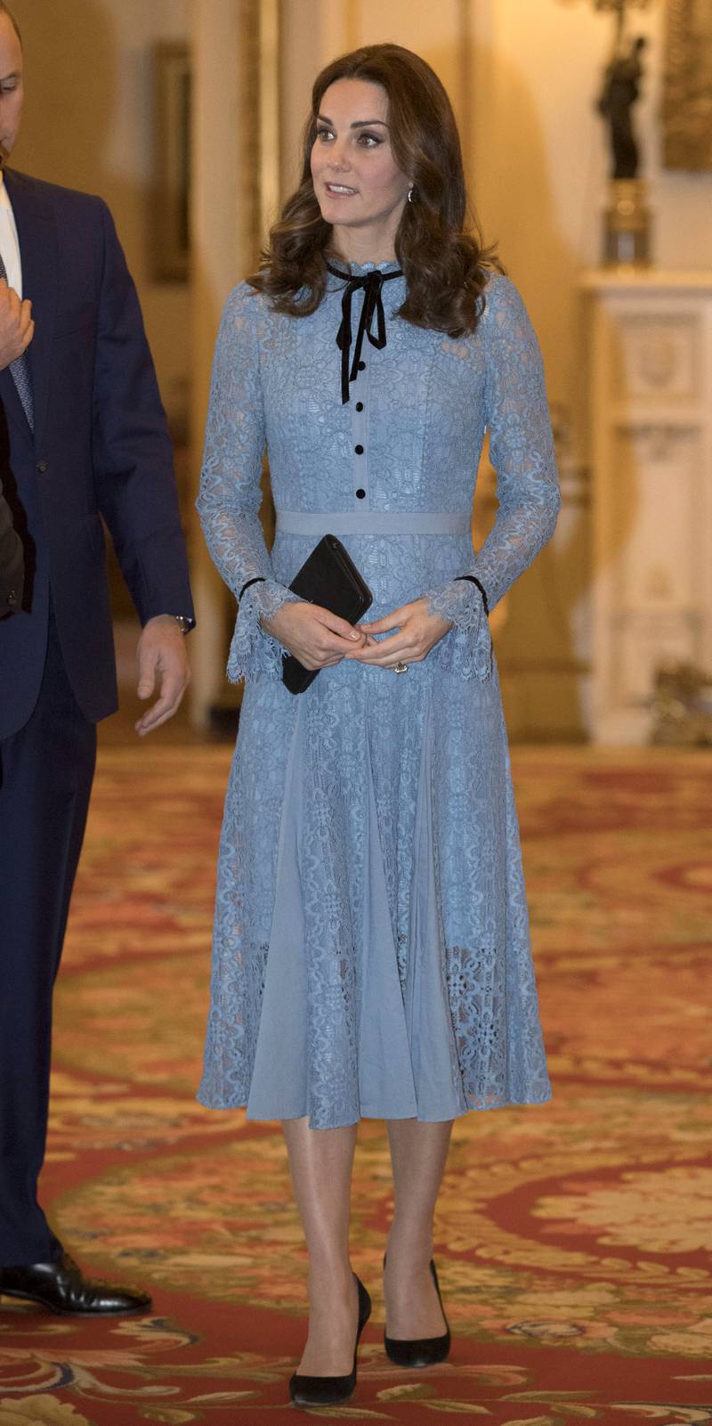 Catherine, Duchess of Cambridge, in blue lace Temperley London, attends a World Mental Health Day reception at Buckingham Palace in London on October 10, 2017. Getty Images