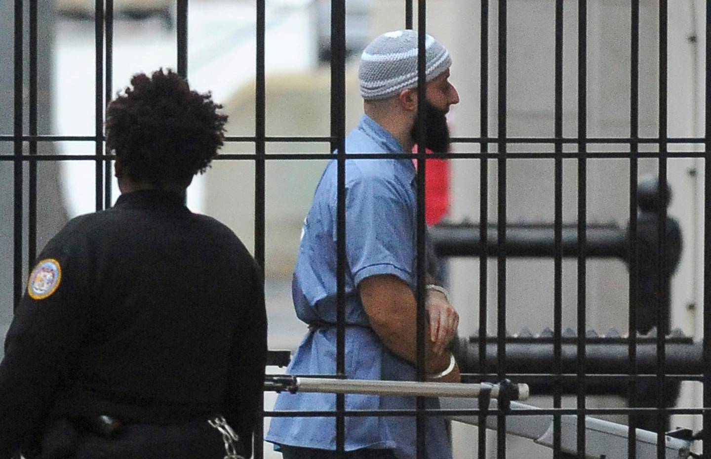FILE - In this Feb. 3, 2016 file photo, Adnan Syed enters Courthouse East in Baltimore prior to a hearing.    A Maryland appeals court has upheld a ruling, Thursday, March 29, 2018,  granting a new trial to Syed, whose conviction in the murder of his high school sweetheart became the subject of the popular podcast "Serial." Syed was convicted in 2000 of killing Hae Min Lee and burying her body in a shallow grave in a Baltimore park. A three-judge panel on Thursday upheld a lower court ruling granting him new trial.(Barbara Haddock Taylor/The Baltimore Sun via AP)