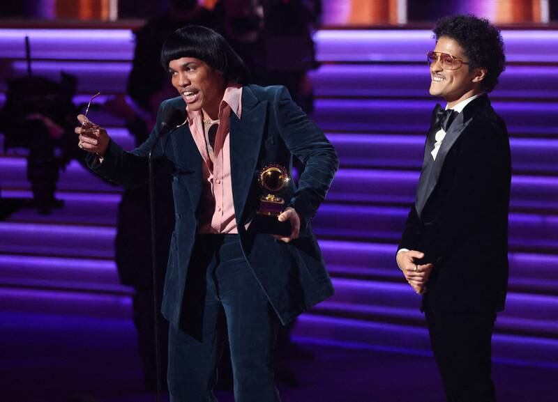 Anderson . Paak and Bruno Mars (R) of Silk Sonic accept the award for Record of the Year for 'Leave the Door Open' during the 64th Annual Grammy Awards. Reuters