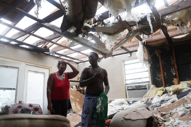 Latasha Myles and Howard Anderson stand in their living room in Lake Charles, Louisiana. AFP