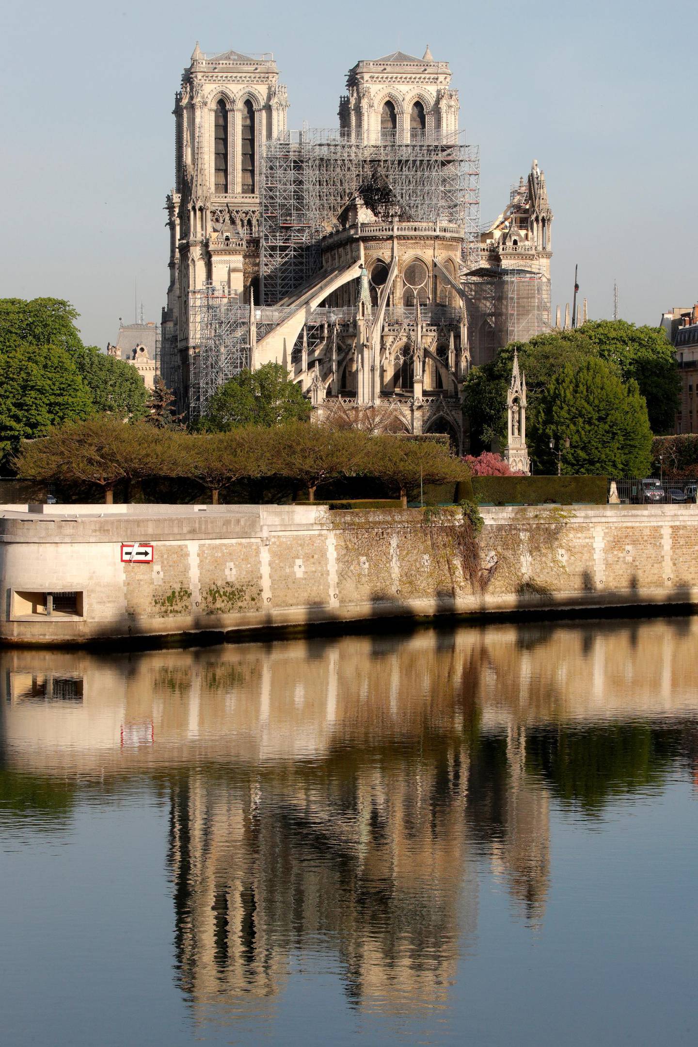 A view shows Notre-Dame Cathedral reflected on the River Seine after a massive fire devastated large parts of the gothic structure in Paris, France, April 18, 2019.  REUTERS/Philippe Wojazer