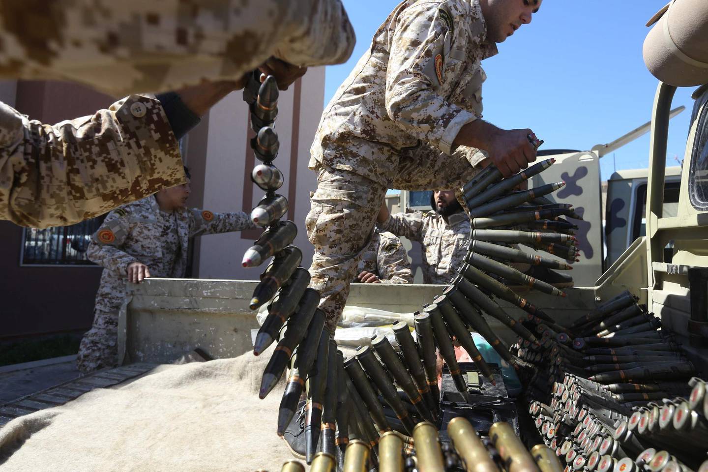 (FILES) In this file photo taken on April 08, 2019, fighters from a Misrata armed group loyal to the internationally recognised Libyan Government of National Accord (GNA) prepare their ammunition before heading to the frontline as battles against Forces of Libyan strongman Khalifa Haftar, in Tripoli The US charged on July 16, 2020, that the EU's Operation Irini to enforce a UN embargo on sending weapons to war-torn Libya lacked seriousness, sharing Turkey's criticism that the effort is biased. / AFP / Mahmud TURKIA
