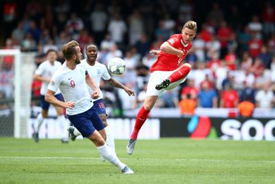 GUIMARAES, PORTUGAL - JUNE 09: Nico Elvedi of Switzerland shoots while under pressure from Harry Kane of England during the UEFA Nations League Third Place Playoff match between Switzerland and England at Estadio D. Afonso Henriques on June 09, 2019 in Guimaraes, Portugal. (Photo by Jan Kruger/Getty Images)