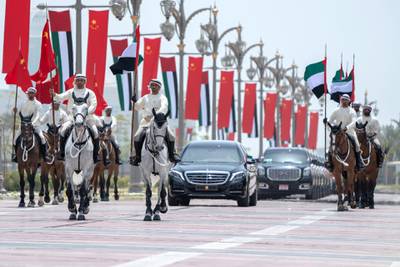 ABU DHABI, UNITED ARAB EMIRATES - July 20, 2018: Members of the UAE Armed Forces Cavalry Division escort HE Xi Jinping, President of China (in vehicle), upon his arrival at the Presidential Palace. 

( Hamad Al Mansoori for Crown Prince Court - Abu Dhabi )