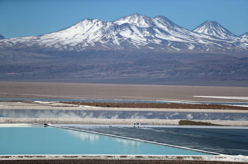 Mountains provide a stunning backdrop to a lithium mine brine pool at the Atacama Salt Flat in Chile. Reuters
