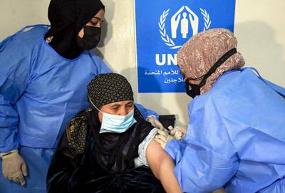 A Syrian refugee receives a Covid-19 vaccine at a medical centre in the Zaatari refugee camp in Jordan in February. AFP