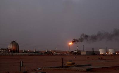 Above, an Aramco oil installation in the Saudi Arabian desert near Al Khurais. Marwan Naamani / AFP