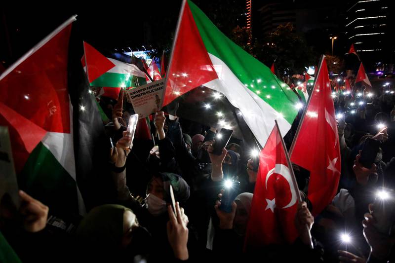 Demonstrators wave Turkish and Palestinian flags during a protest against Israel near the Israeli Consulate in Istanbul, Turkey. Reuters