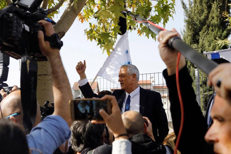 Benny Gantz, leader of Blue and White party, gestures as he speaks to members of the media as Israelis began voting in a parliamentary election, near a polling station in Rosh Ha'ayin, Israel April 9, 2019. REUTERS/Nir Elias