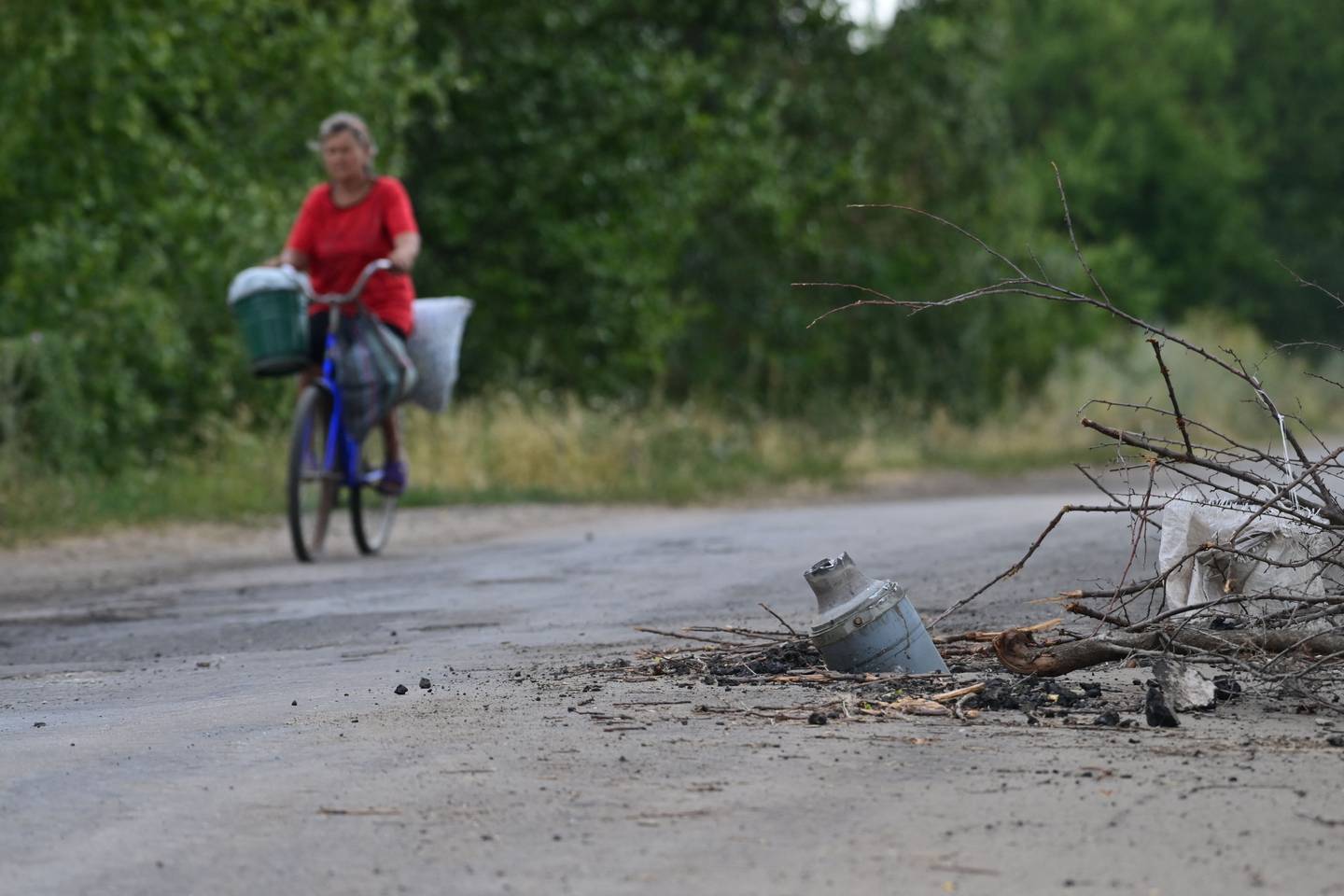 A spent Russian rocket half buried in the street near Siversk, in Donetsk. AFP