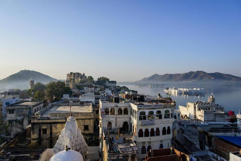 Udaipur, on Lake Pichola, has marble palaces, temples, luxury hotels, fine dining, arts, culture and shopping. Rodolfo Contreras / Alamy