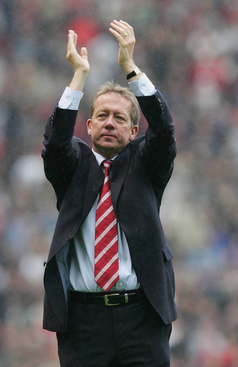 MANCHESTER, UNITED KINGDOM - MAY 07: Alan Curbishley of Charlton Athletic applauds the fans after his final match in charge after the Barclays Premiership match between Manchester United and Charlton Athletic at Old Trafford on May 7, 2006  in Manchester, England.  (Photo by Laurence Griffiths/Getty Images)