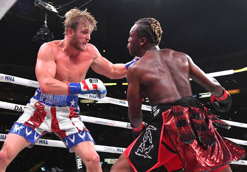 Logan Paul, left, and KSI exchange punches their pro debut fight at Staples Center in Los Angeles, California. KSI won by split decision. AFP