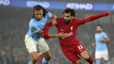 Liverpool's Mohamed Salah battles with Manchester City's Nathan Ake during the Carabao Cup fourth round match at the Etihad Stadium, Manchester. Picture date: Thursday December 22, 2022.