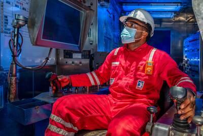 An Adnoc employee uses a training simulator used to enhance workplace safety. Photo: Adnoc