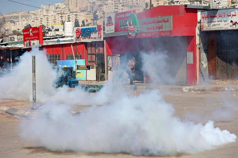 Teargas fills a street in Nablus during the Israeli raid. AFP