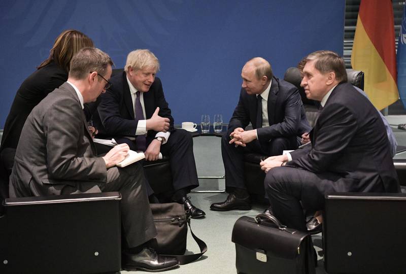 Britain's Prime Minister Boris Johnson and Russian President Vladimir Putin meet on the sidelides of a Peace summit on Libya in Berlin. AFP