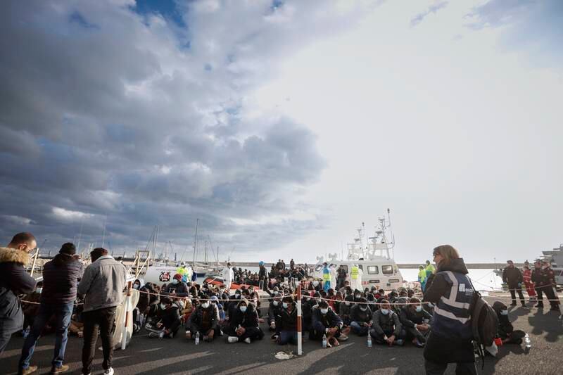 Migrants arrive after being rescued at sea by an Italian Coast Guard ship, at the port of Pozzallo, Sicily. EPA