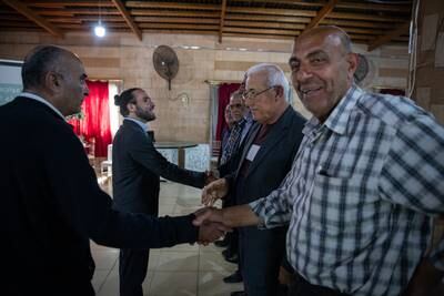 Ali Khalifeh, Shiite opposition candidate for Al-Zahrani in Southern Lebanon, greets supporters in the restaurant hall.