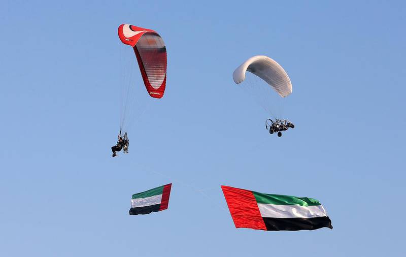 Paragliders perform during the UAE 45th National Day celebration held at the corniche in Fujairah.  Pawan Singh / The National