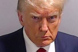 FILE PHOTO: Former U. S.  President Donald Trump is shown in a police booking mugshot released by the Fulton County Sheriff's Office, after a Grand Jury brought back indictments against him and 18 of his allies in their attempt to overturn the state's 2020 election results in Atlanta, Georgia, U. S. , August 24, 2023.  Fulton County Sheriff's Office/Handout via REUTERS  THIS IMAGE HAS BEEN SUPPLIED BY A THIRD PARTY.   THIS PICTURE WAS PROCESSED BY REUTERS TO ENHANCE QUALITY.  AN UNPROCESSED VERSION HAS BEEN PROVIDED SEPARATELY.  / File Photo