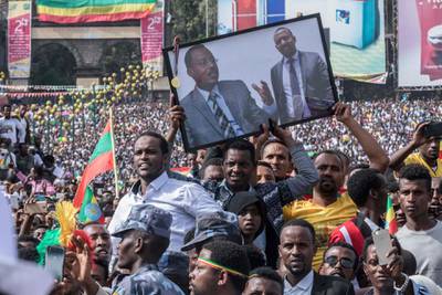 Supporters of Ethiopia Prime Minister attend a rally on Meskel Square in Addis Ababa on June 23, 2018. One person died and scores of others were hurt after a grenade blast at new Ethiopian Prime Minister Abiy Ahmed's first mass rally in the capital that sent crowds fleeing in panic. Abiy had just wrapped up his speech before tens of thousands of people in the heart of Addis Ababa when the explosion went off, sending droves of supporters towards the stage as the prime minister left hurriedly, an AFP correspondent said.
 / AFP / YONAS TADESSE
