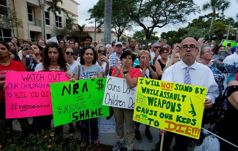 Protesters take part in a Call To Action Against Gun Violence rally by the Interfaith Justice League and others in Delray Beach, Florida, U.S. February 19, 2018. REUTERS/Joe Skipper