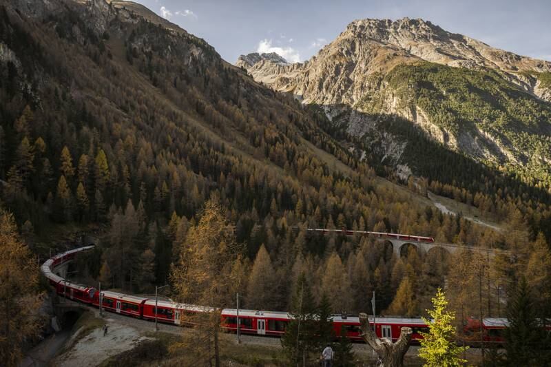 A Rhaetian Railway train is on its way to set a world record for longest passenger train on the Unesco world heritage track from Preda to Alvaneu, in Preda, Switzerland. EPA