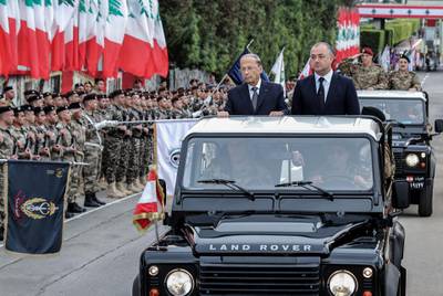 epa08018268 A handout photo made available by official Lebanese photographer Dalati nohra shows President Michel Aoun (L)  minister of defense Elias Abou Saab (R) attend the military parade of the 76th anniversary of Lebanese independence day at the Defense Ministry headquarters in Yarze east of beirut , Lebanon 22 November 2019. Lebanon celebrates the 76th anniversary of its independence with protesters marking the day by holding various events, as marching in groups of Doctors, lawyers, engineers, industrialists, women's associations, retired soldiers and army officers, for their vindication to obtain political changes.  EPA/DALATI NOHRA HANDOUT  HANDOUT EDITORIAL USE ONLY/NO SALES