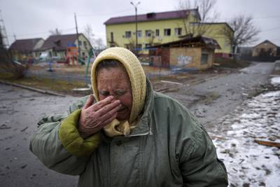 Tears outside a house damaged by a Russian airstrike in Gorenka, on the outskirts of Kyiv. AP Photo
