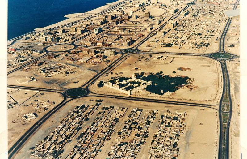 This aerial view of Abu Dhabi was taken in 1974. New buildings are rising and Qasr Al Hosn is prominent. Courtesy Ron McCulloch