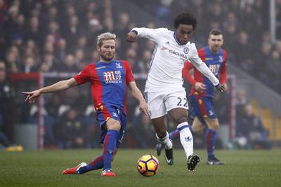 Crystal Palace’s Yohan Cabaye vies with Chelsea’s Willian during the match. Adrian Dennis / AFP