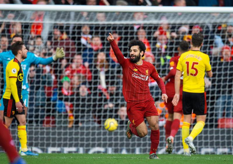 Liverpool's Mohamed Salah celebrates scoring the first goal in a 2-0 Premier League win against Watford. EPA