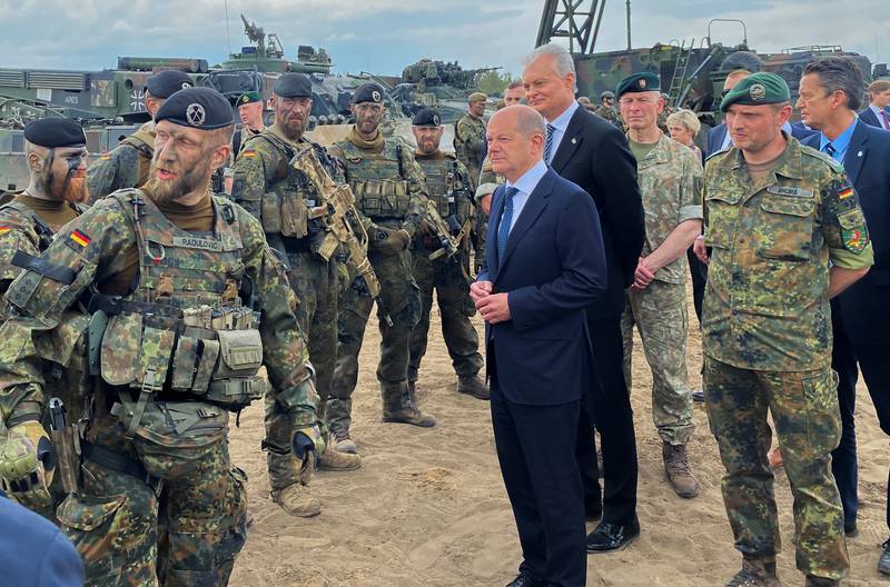 German Chancellor Olaf Scholz and Lithuanian President Gitanas Nauseda visit German troops of the Nato-enhanced Forward Presence Battlegroup in Lithuania on June 7. Reuters