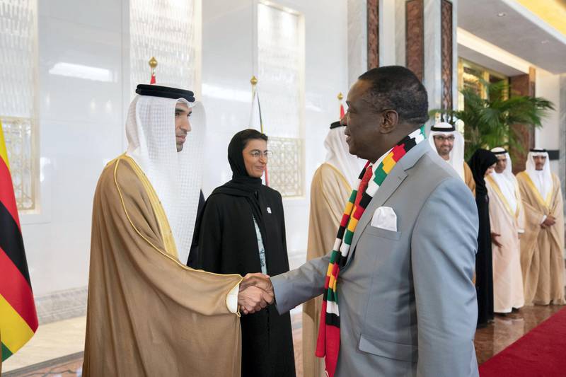 ABU DHABI, UNITED ARAB EMIRATES - March 16, 2019:  HE Dr Thani Al Zeyoudi, UAE Minister for Climate Change and Environment (L) greets HE Emmerson Mnangagwa, President of Zimbabwe (R), during a reception at the Presidential Airport. 

( Ryan Carter for the Ministry of Presidential Affairs )
---