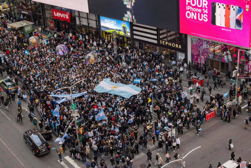 People celebrate after Argentina's World Cup win at Times Square in New York City. AFP