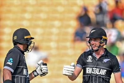 New Zealand's Will Young, right, celebrates with his teammate Rachin Ravindra after scoring a half-century. AFP