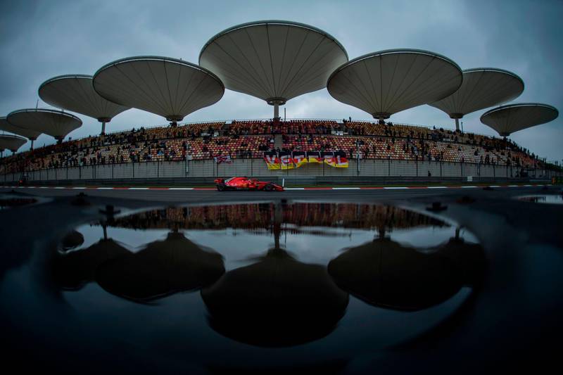 TOPSHOT - CORRECTION - Ferrari's German driver Sebastian Vettel drives on the straight during a practice session for the Formula One Chinese Grand  Prix in Shanghai on April 14, 2018.  / AFP PHOTO / Johannes EISELE / “The erroneous mention[s] appearing in the metadata of this photo by Johannes EISELE has been modified in AFP systems in the following manner: [April 14, 2018] instead of [April 13, 2018]. Please immediately remove the erroneous mention[s] from all your online services and delete it (them) from your servers. If you have been authorized by AFP to distribute it (them) to third parties, please ensure that the same actions are carried out by them. Failure to promptly comply with these instructions will entail liability on your part for any continued or post notification usage. Therefore we thank you very much for all your attention and prompt action. We are sorry for the inconvenience this notification may cause and remain at your disposal for any further information you may require.”