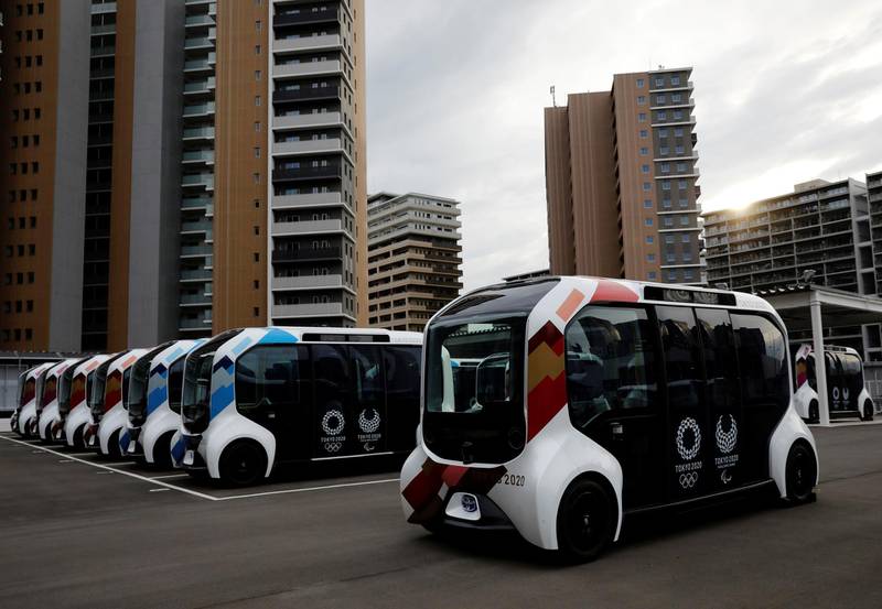 Electric vehicles are pictured at an internal shuttle bus station.