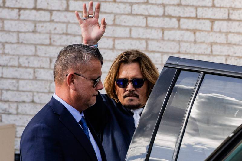 A social media expert said that during Depp's London trial against 'The Sun', every tweet with the hashtag #justiceforjohnny contained negative language concerning Heard. AFP