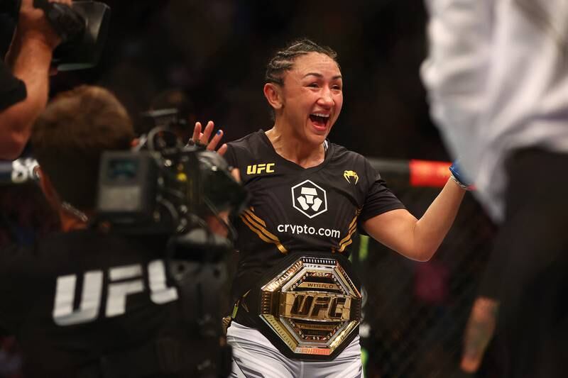 Carla Esparza reacts to her championship victory against Rose Namajunas at UFC 274. Reuters