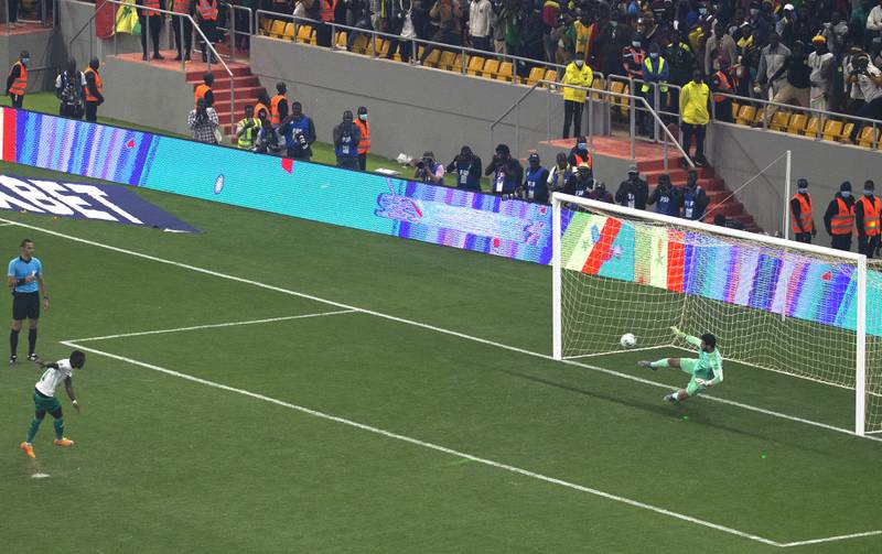 Senegal's Sadio Mane finishes past Egypt goalkeeper Mohamed El Shennawy in the shoot-out. AP